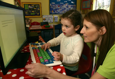 One girl learning using a computer